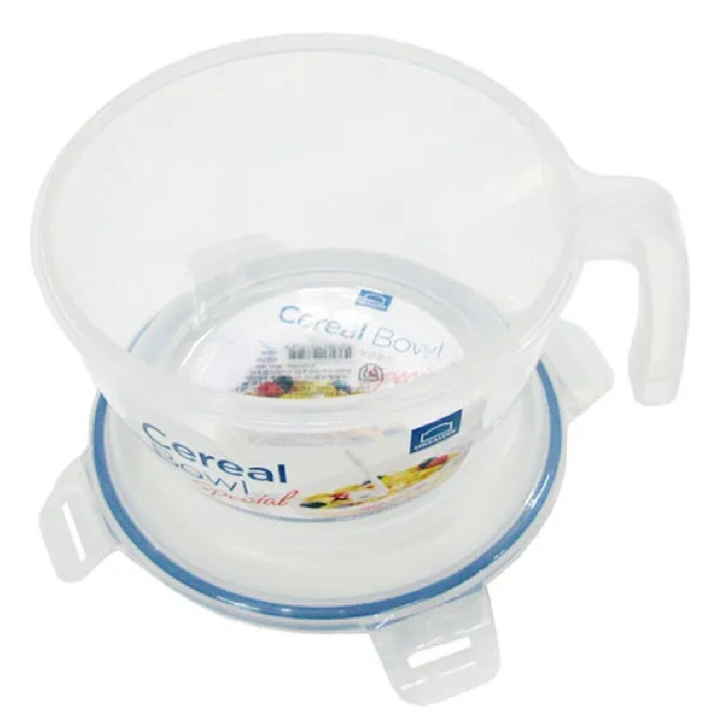 Przezroczysta miska na płatki z pokrywką na białej powierzchni.