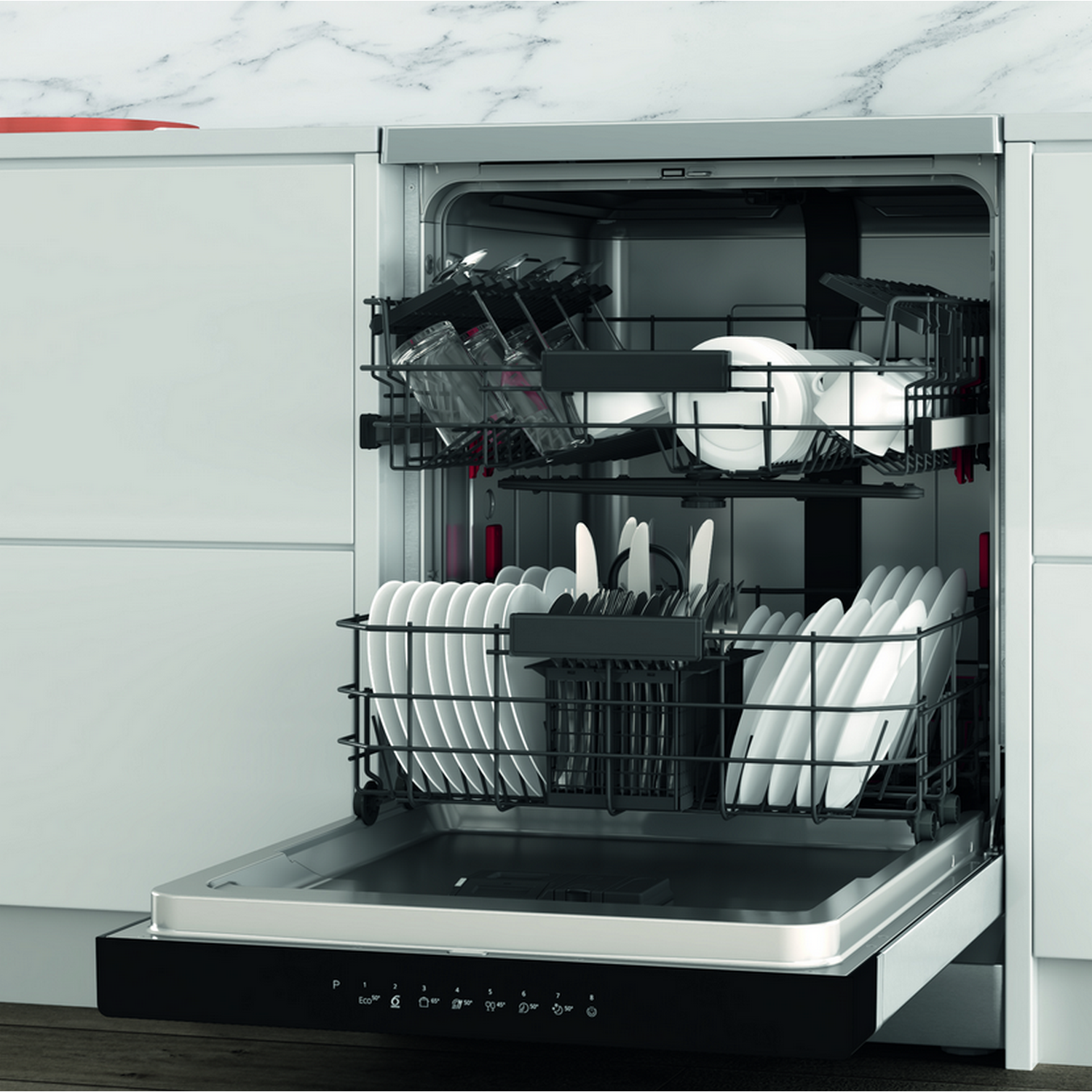 Dishwasher with door open, inside are dishes and glasses, white and black.