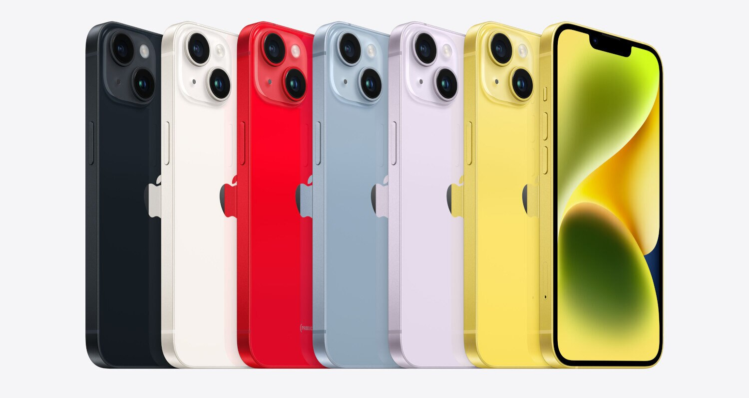 Siedem iPhone'ów w kolorach: ciemnoniebieski, biały, czerwony, jasnoniebieski, fioletowy, żółty i żółty.