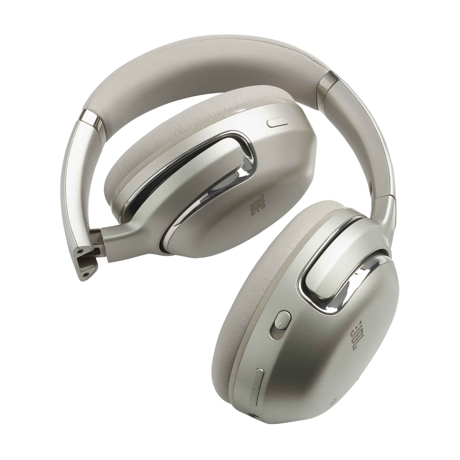 Silver JBL headphones on a black surface, angled with the earcups open.