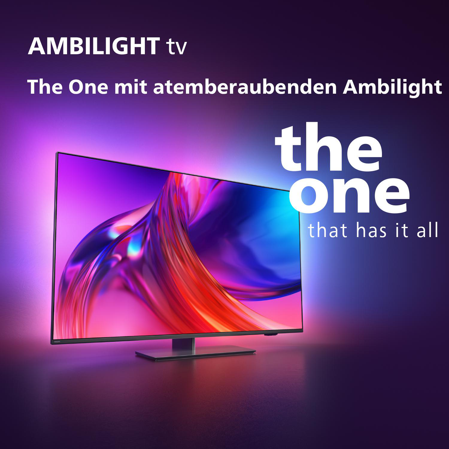 Ein großer TV-Bildschirm mit den Worten 'the one' und farbenfrohen Lichteffekten.
