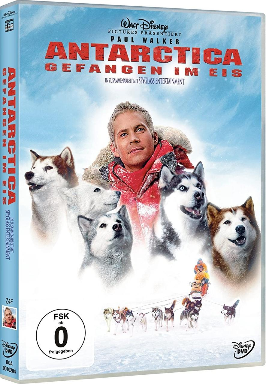 DVD-Cover: Paul Walker mit Huskys, Filmtitel 'Antarctica'.