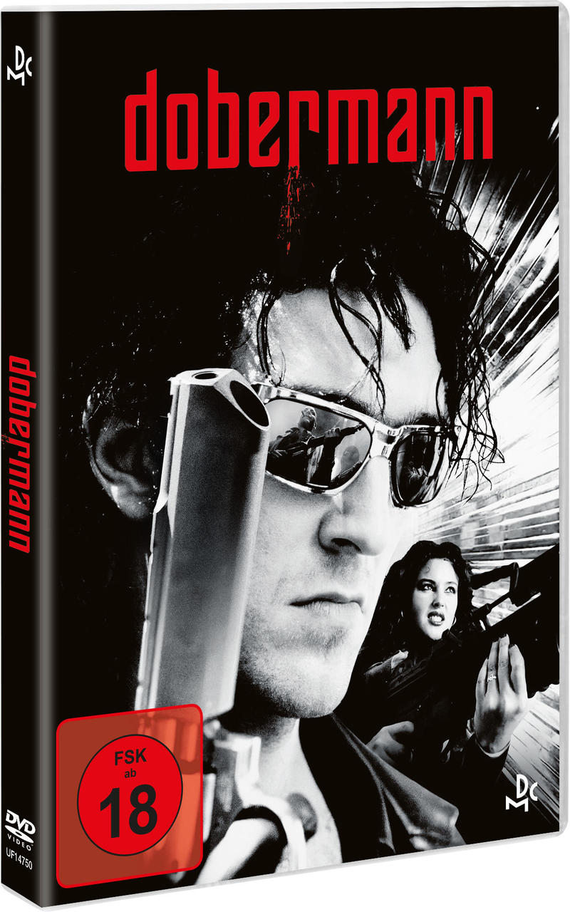 Dobermann DVD-Cover. Ein Mann mit Sonnenbrille hält eine Waffe, eine Frau steht hinter ihm.