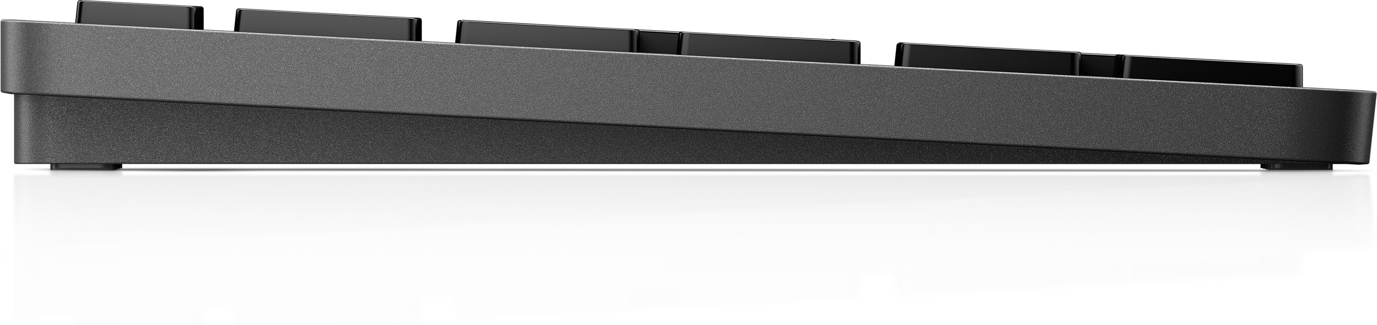 Seitenansicht einer dunkelgrauen Tastatur mit schwarzen Tasten. Flaches Design.