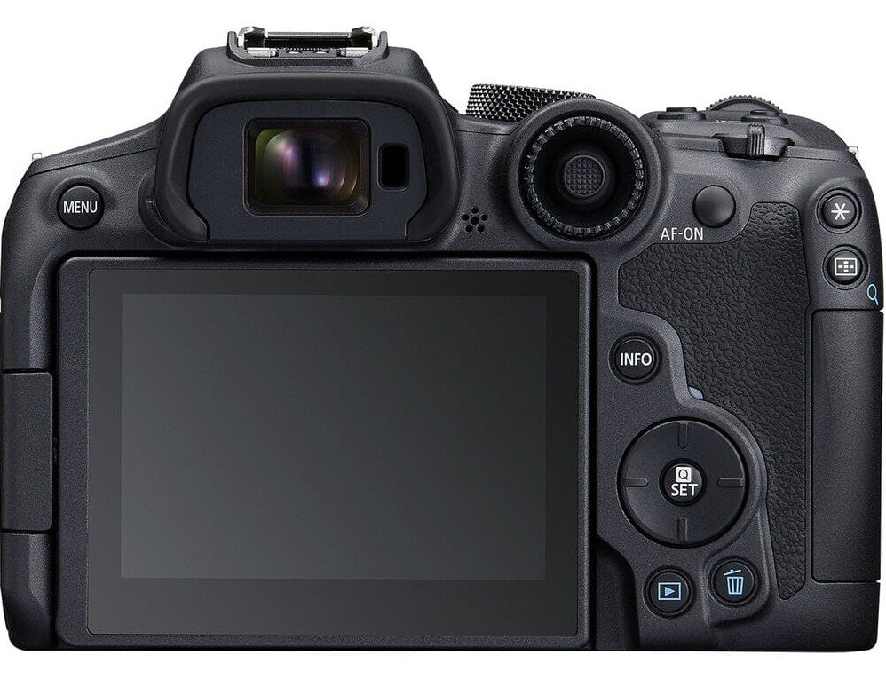 Widok z tyłu czarnego aparatu z ekranem i przyciskami, prezentujący różne elementy sterujące.