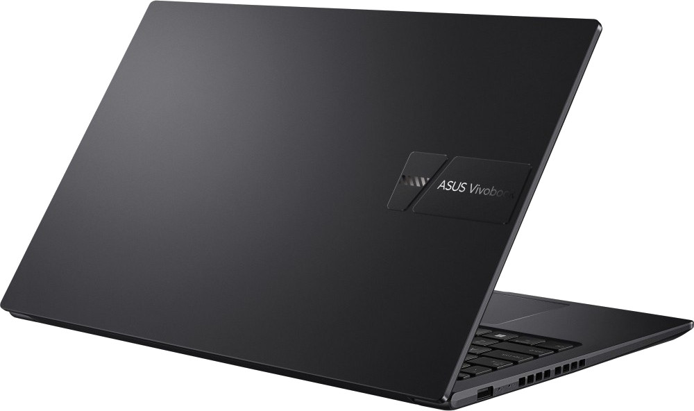 Ordinateur portable ASUS Vivobook noir, partiellement ouvert. Le couvercle affiche le logo de la marque. Clavier visible. L'ordinateur est incliné.