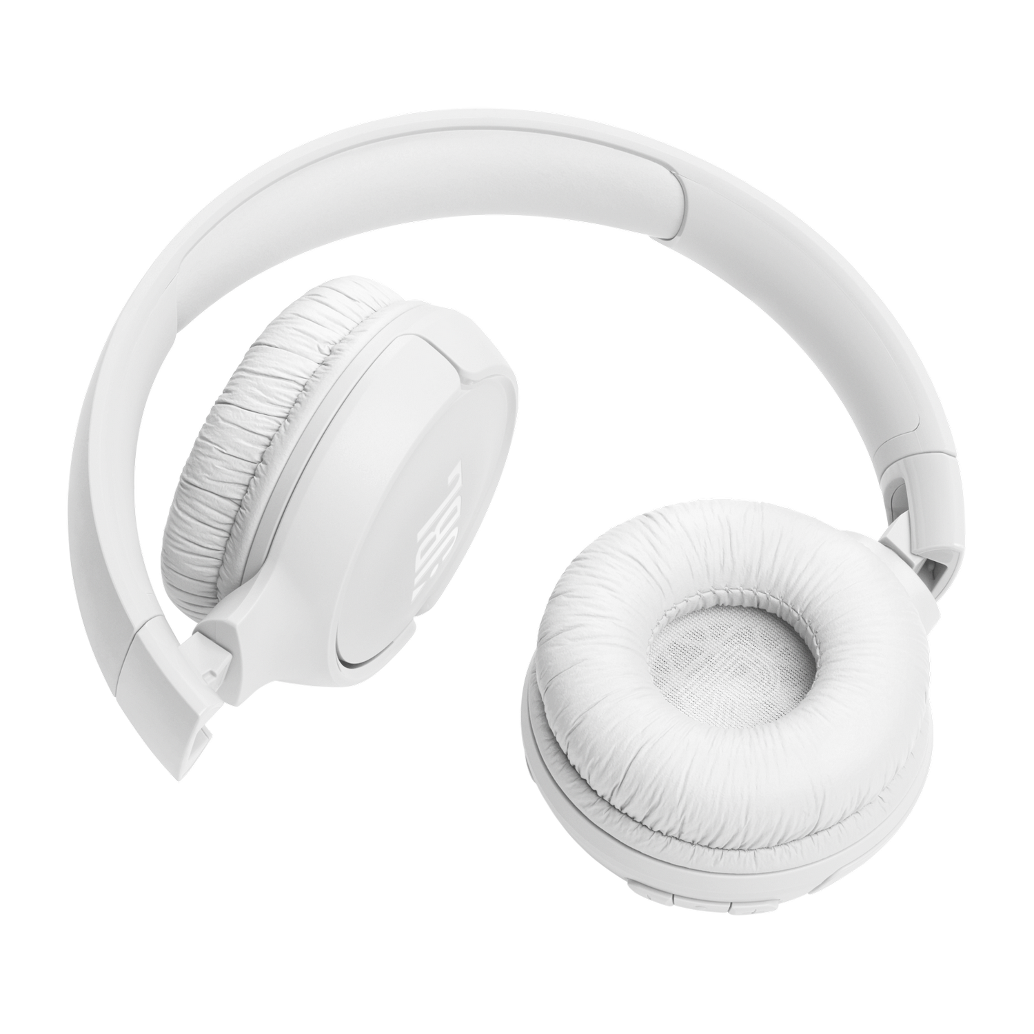 Witte over-ear koptelefoon, open en liggend op een zwart oppervlak.
