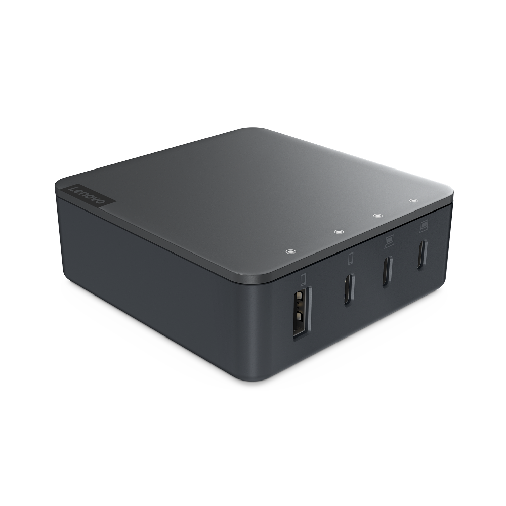 Dispositivo rectangular gris oscuro con puertos, logo Lenovo visible en la parte superior.