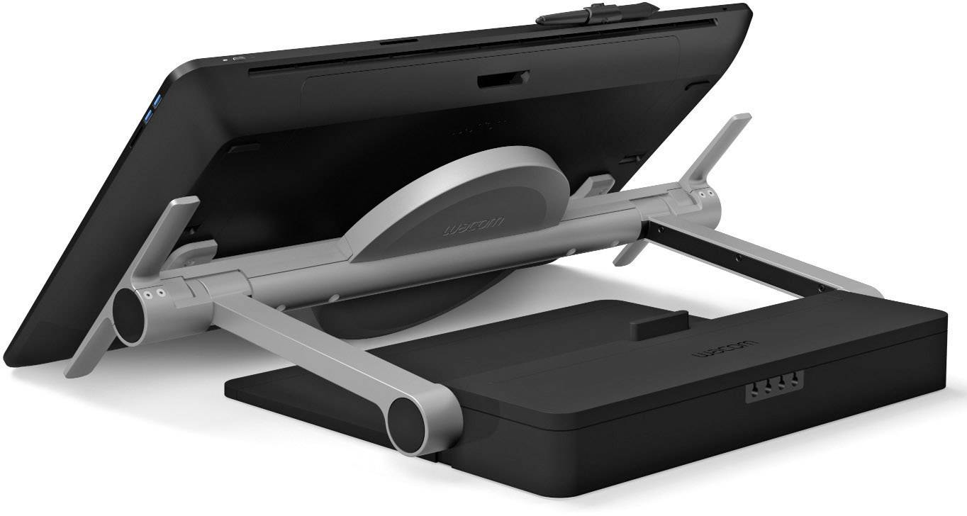 Una tableta de dibujo Wacom negra con un soporte y una base de carga, vista en ángulo.
