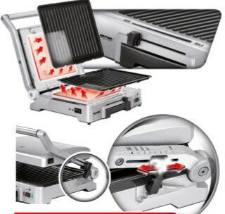 Zbliżenie srebrnego grilla z odpinaną płytą i czerwonymi strzałkami wskazującymi ciepło.