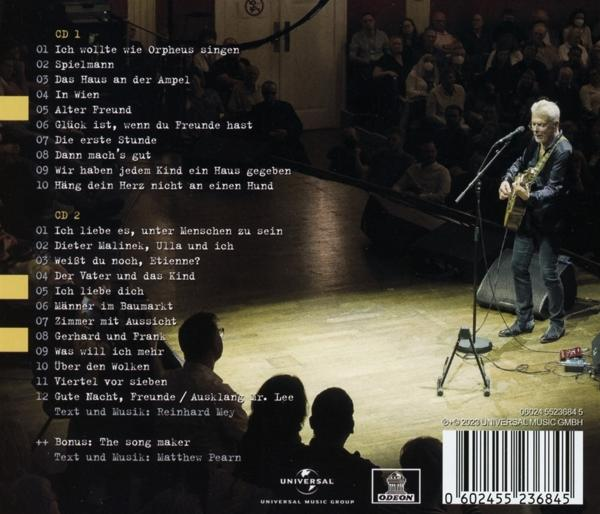 Rückseite einer CD mit Titelliste, ein Mann singt und spielt Gitarre auf einer Bühne.