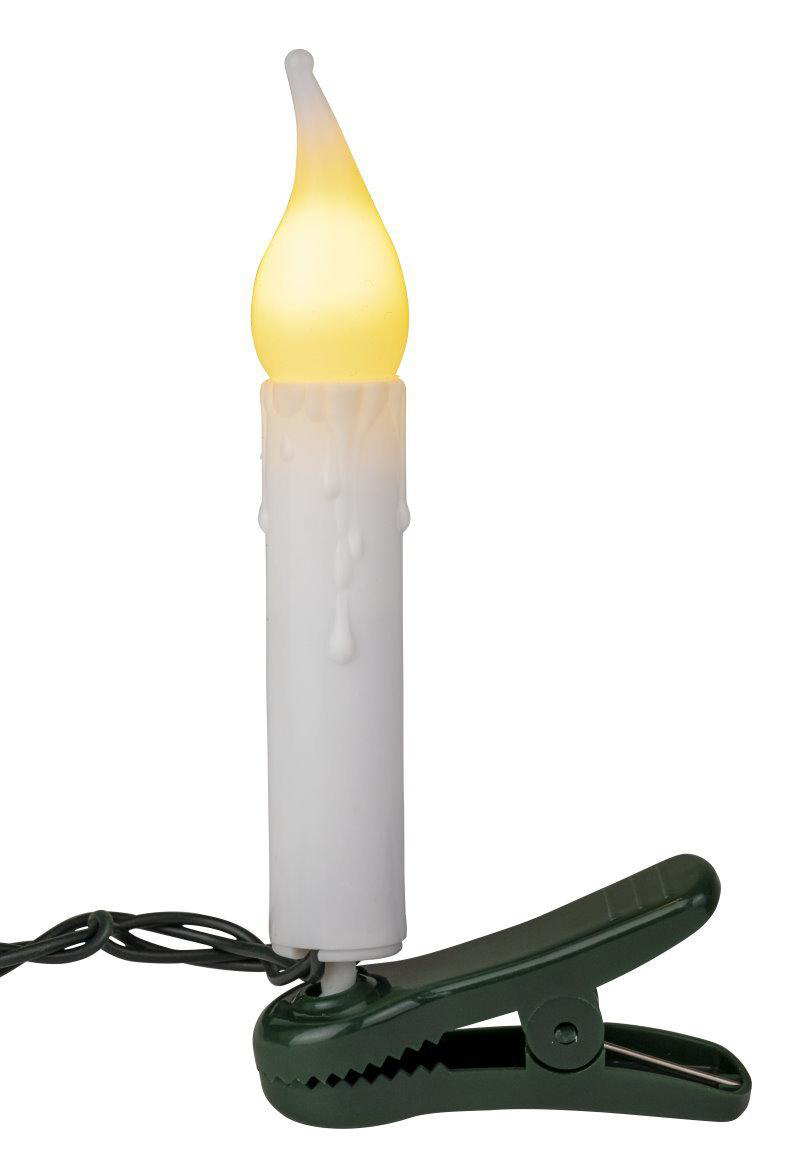 Ein Kerzenlicht mit einem grünen Clip. Die Kerze hat einen weißen Körper mit gelber Flamme.