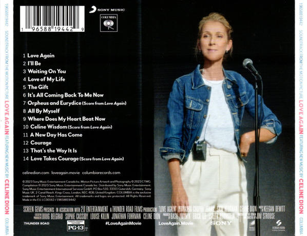 Celine Dion auf einer Bühne, hält ein Mikrofon und bewirbt den 'Love Again'-Soundtrack. Das Albumcover ist sichtbar.