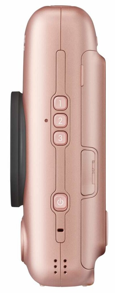 Widok z boku różowo-złotego aparatu, z trzema przyciskami, przyciskiem zasilania i obiektywem.