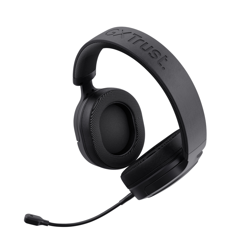 Auriculares gaming Trust negros con micrófono, aislados sobre fondo blanco.