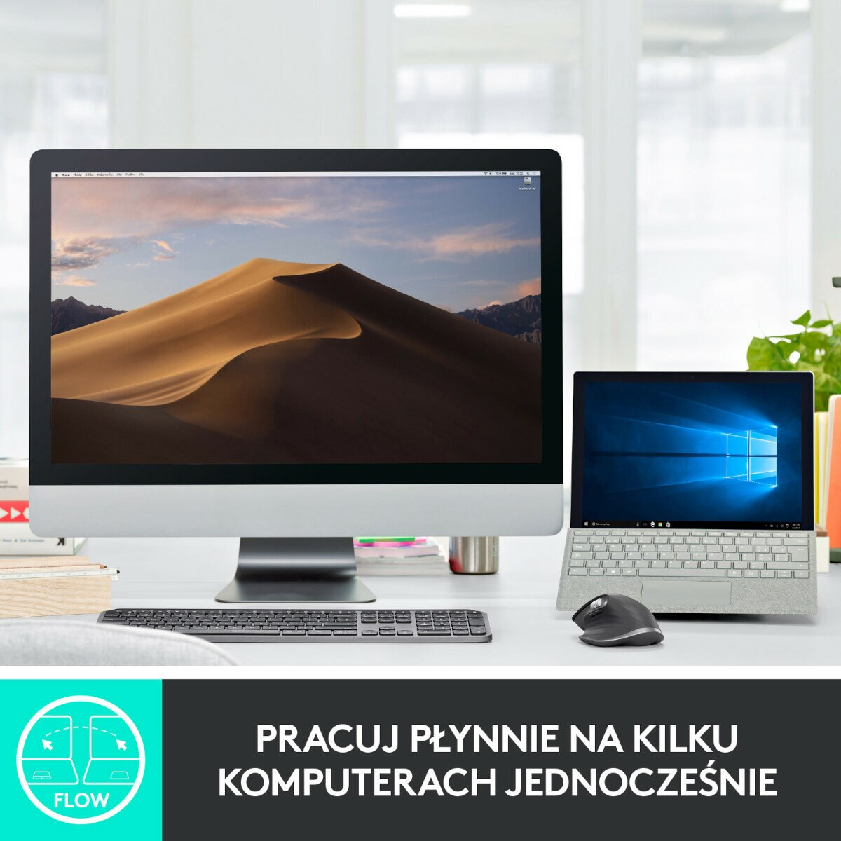 Komputer stacjonarny i laptop na biurku. Laptop ma krajobraz pustynny.