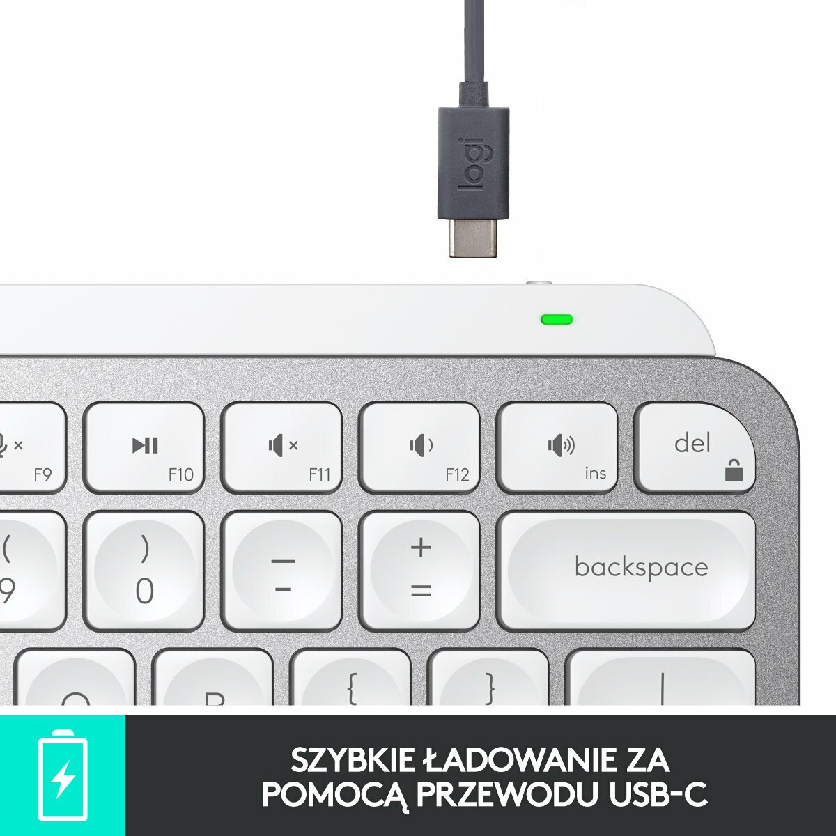 Biała klawiatura z białymi klawiszami, ustawiona pod kątem.