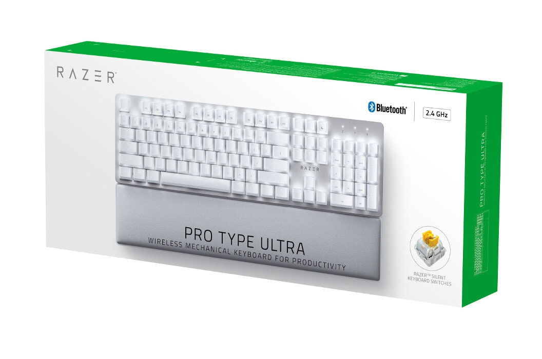 Biała klawiatura Razer w pudełku. Zawiera podpórkę pod nadgarstek i żółtą próbkę przełącznika.