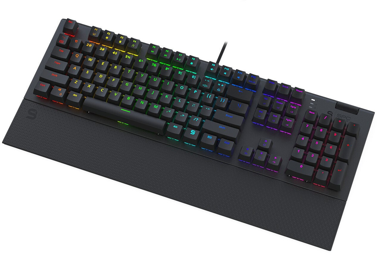 Czarna klawiatura dla graczy z tęczowym podświetleniem, podpórką pod nadgarstek i klawiaturą numeryczną na białej powierzchni.