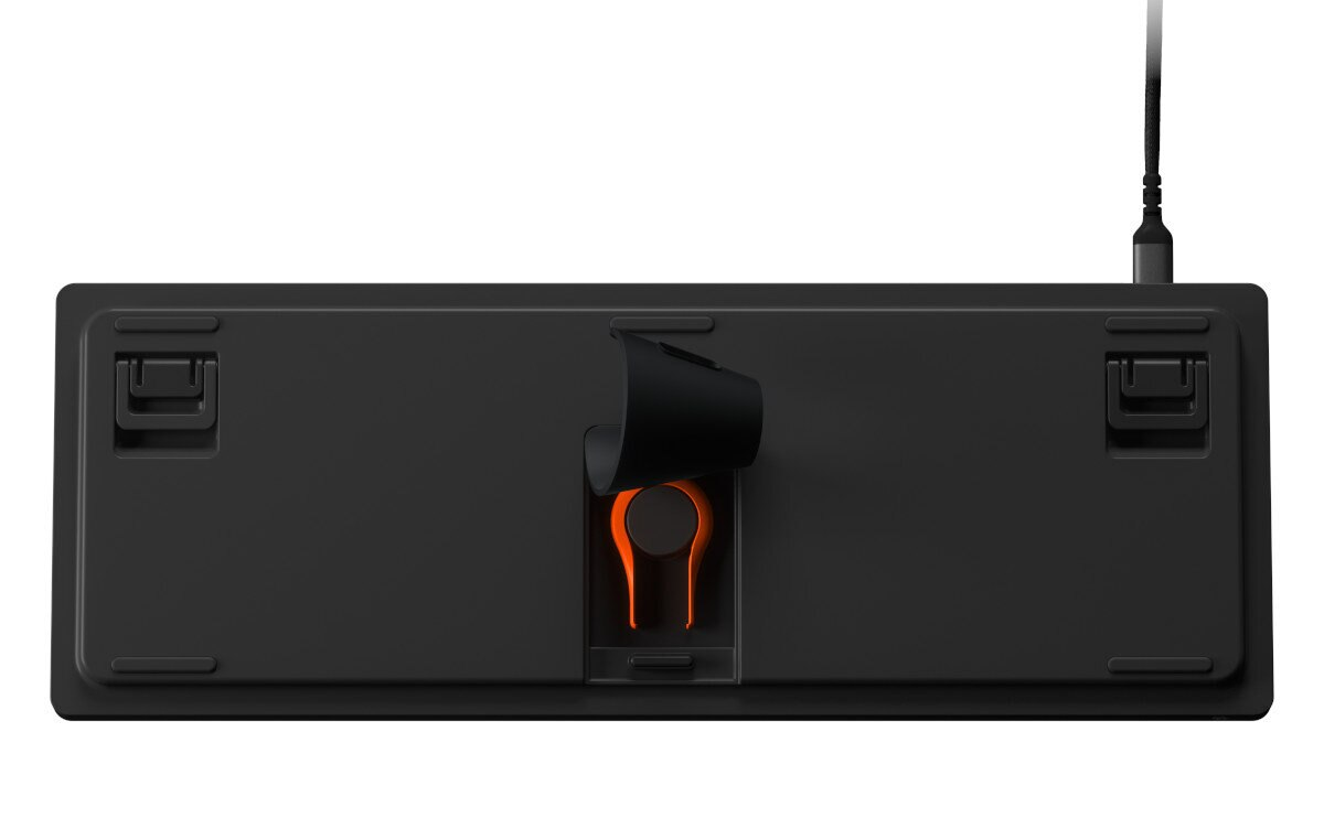 Spód czarnej klawiatury z klipsem na kabel i pomarańczowymi detalami.