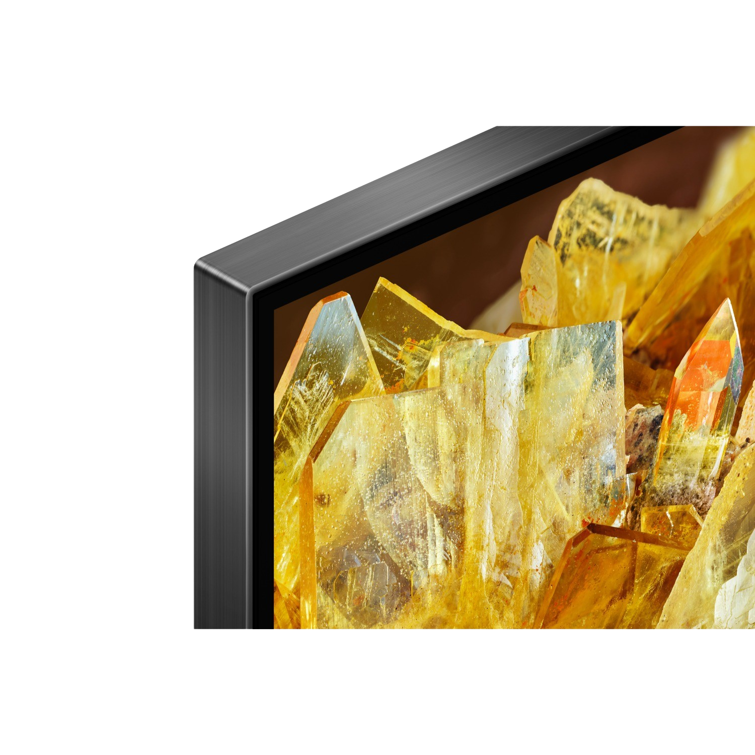 Close-up of a TV frame, showing a golden, crystalline texture.