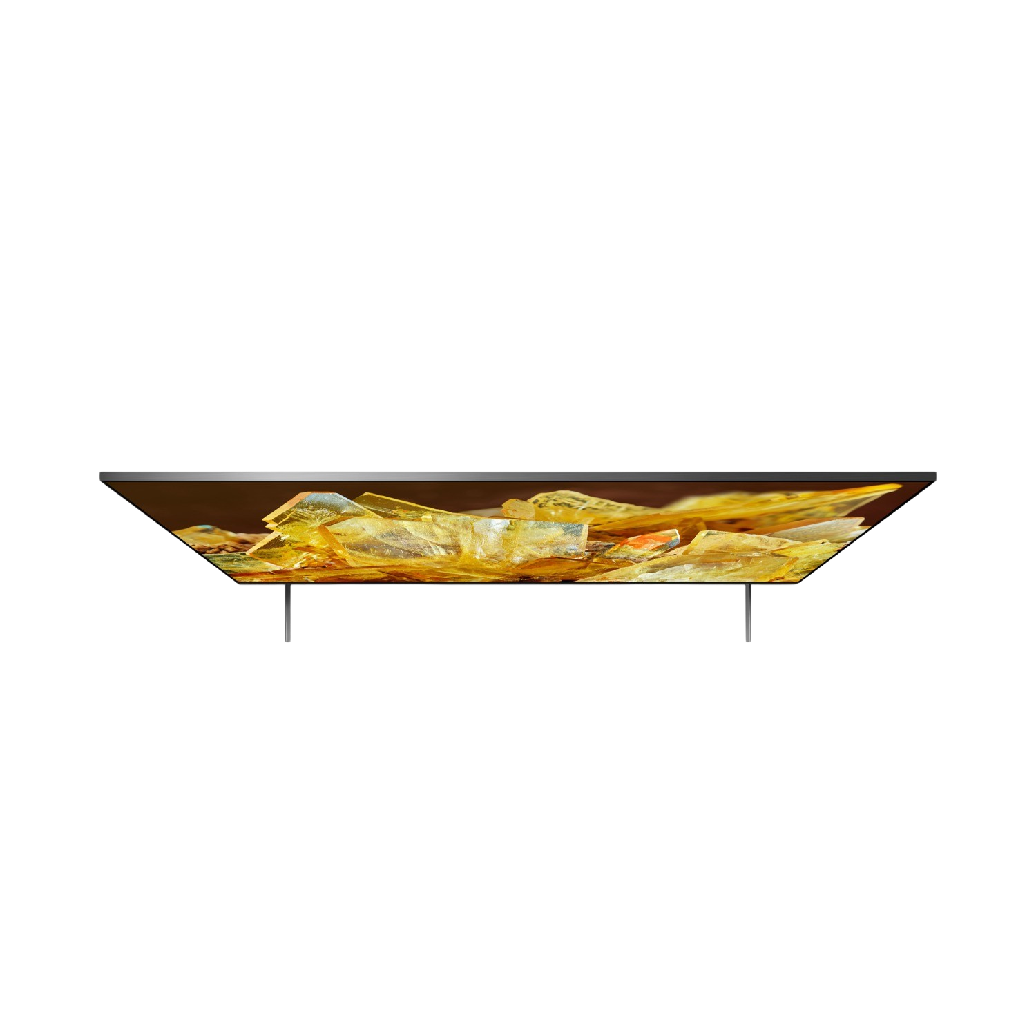 Top view of a TV with golden, yellow, and orange crystals inside. The TV is black.