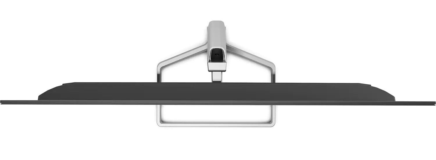 Widok z góry na czarny telewizor ze srebrną podstawą. Podstawa podtrzymuje telewizor.