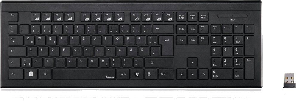 Czarna klawiatura z wieloma klawiszami i odbiornikiem USB na białej powierzchni.