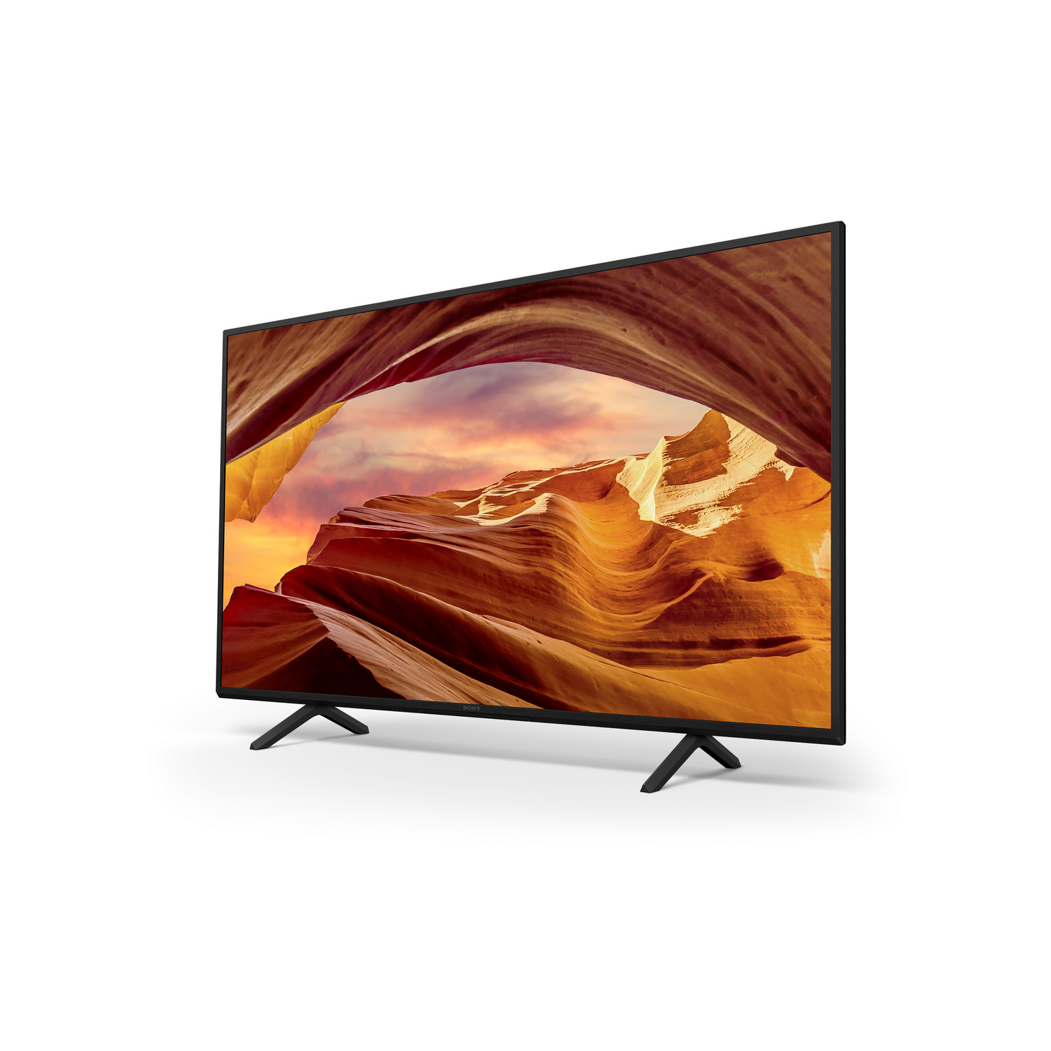 A large TV screen displaying a landscape with orange and yellow colors.