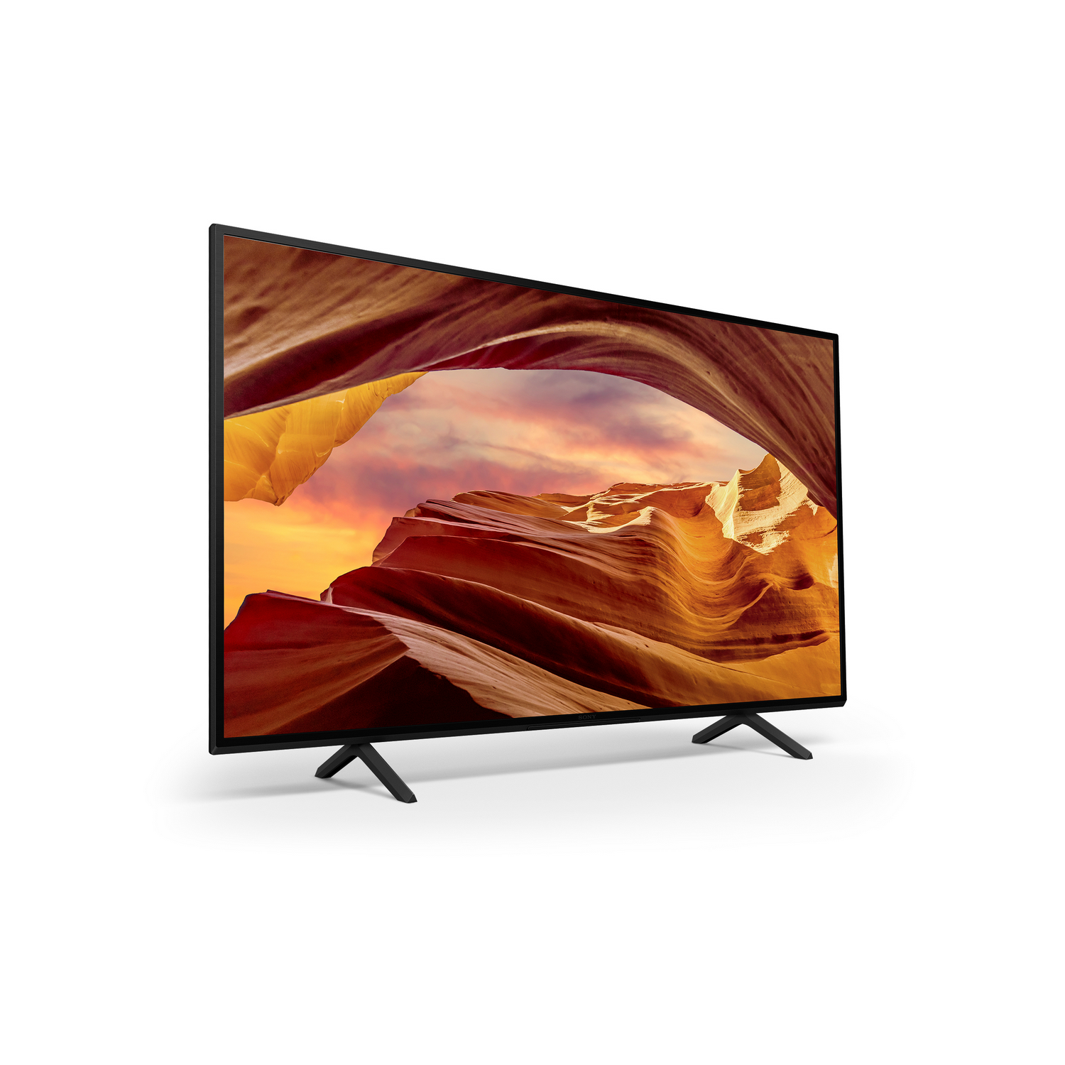 A TV with a canyon landscape on the screen. It is on a white background.