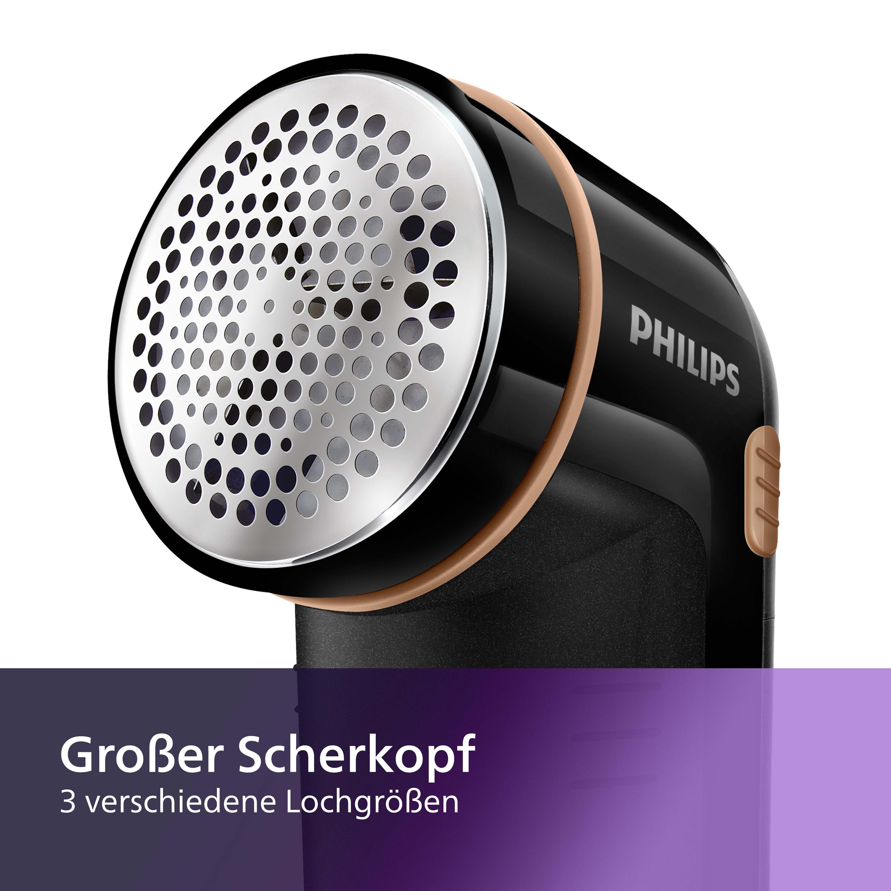 Schwarzer und goldener Philips Stoffrasierer mit kreisförmigem Kopf mit Löchern.