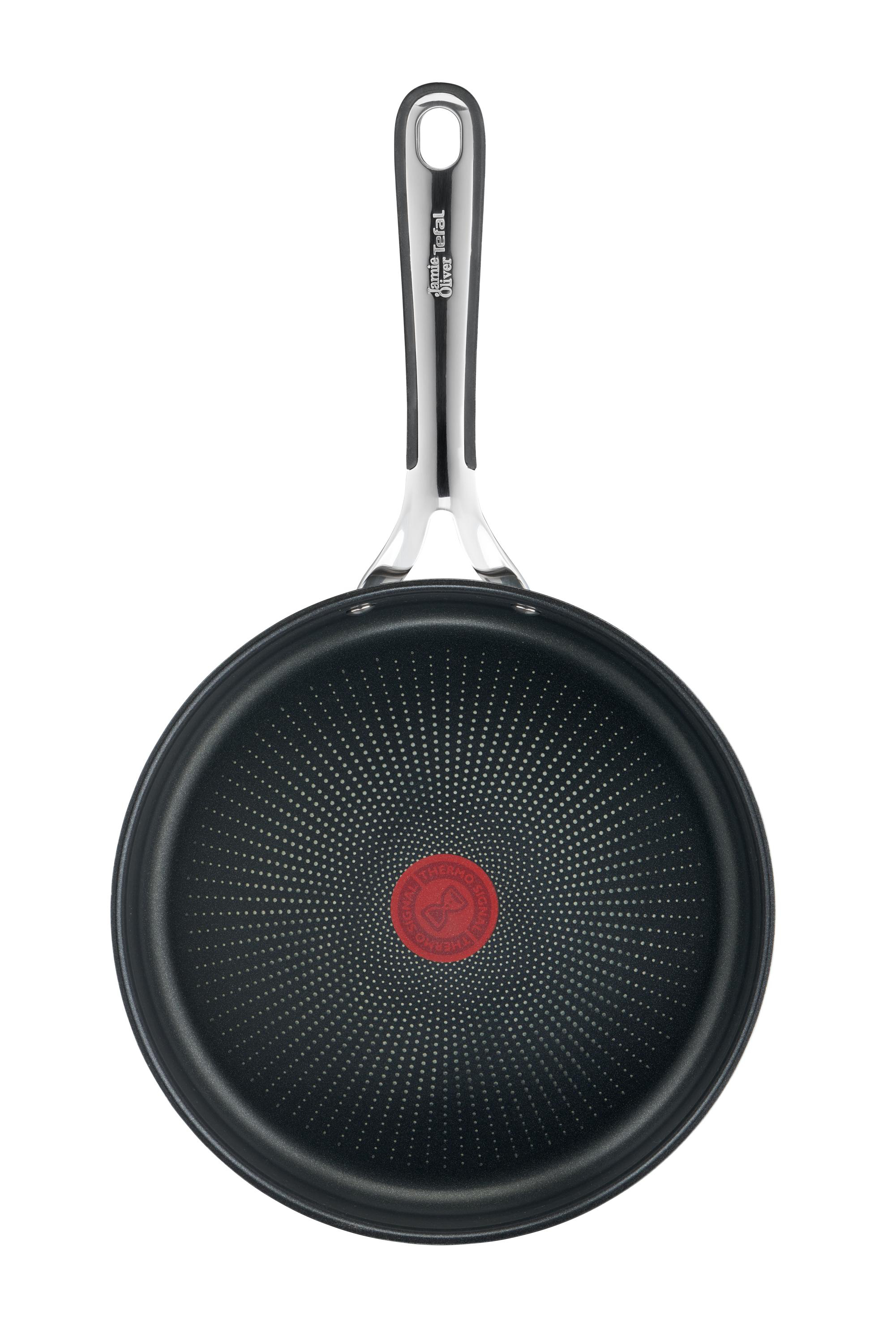 Tefal-Bratpfanne, Draufsicht, schwarz mit rotem Punkt und silbernem Griff auf weißem Grund.