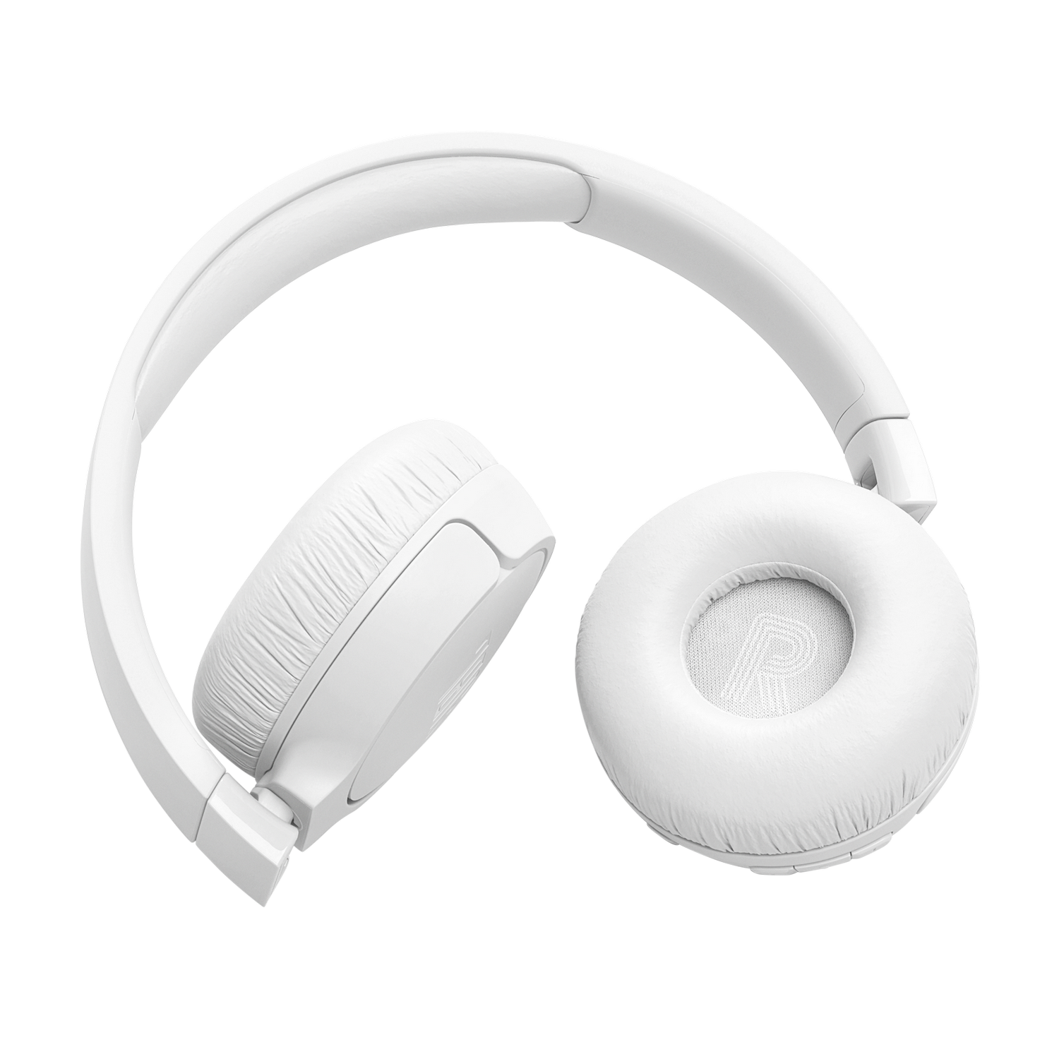 White headphones are placed on a black surface. The earcups are round and cushioned.