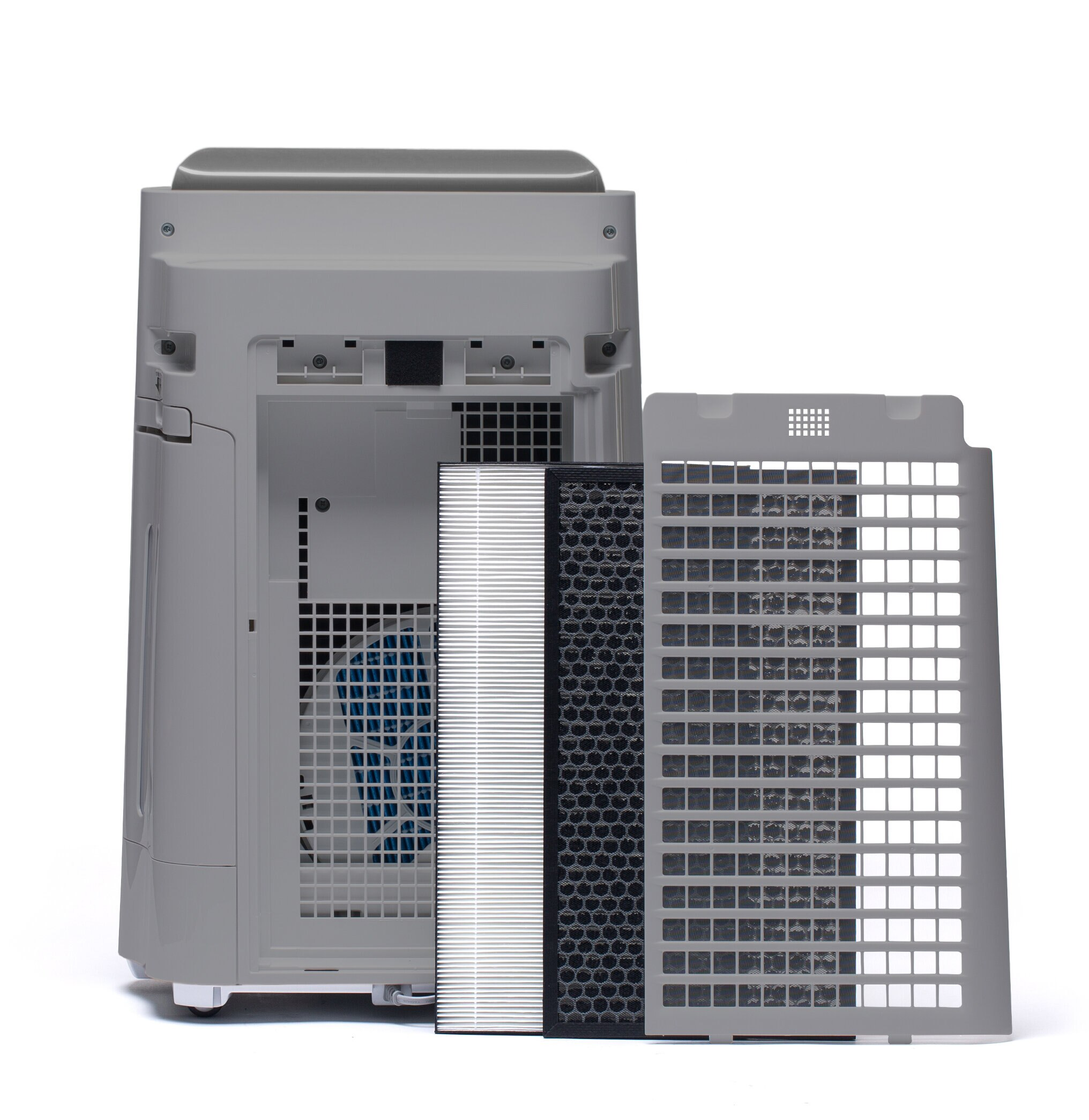 Oczyszczacz powietrza z elementami filtra. Filtr jest biało-czarny i widoczny wewnątrz urządzenia.