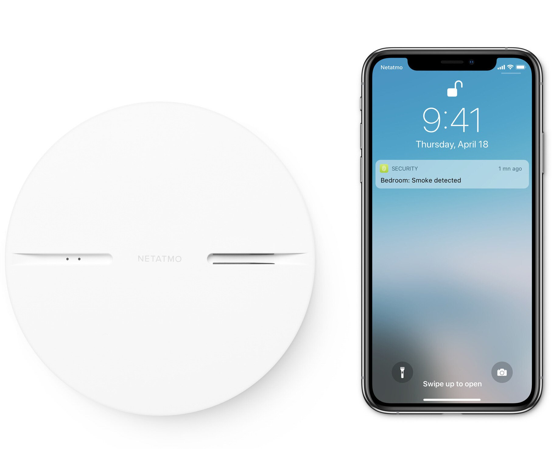 Białe urządzenie Netatmo i smartfon z powiadomieniem o wykryciu dymu.