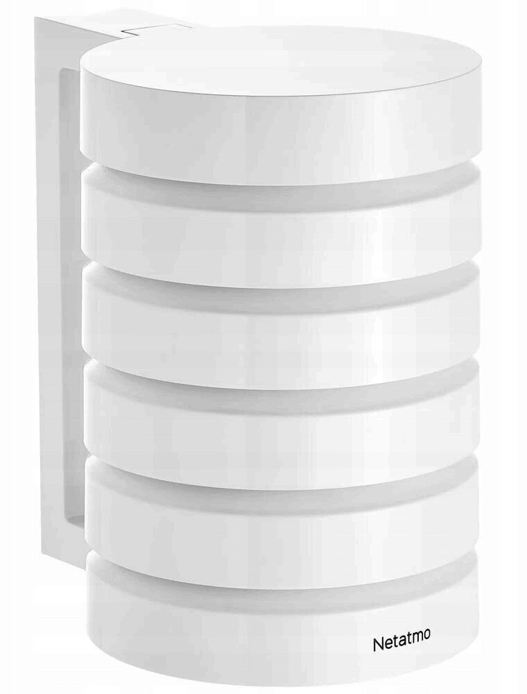 Białe, cylindryczne urządzenie smart home. Posiada poziome linie i etykietę Netatmo.