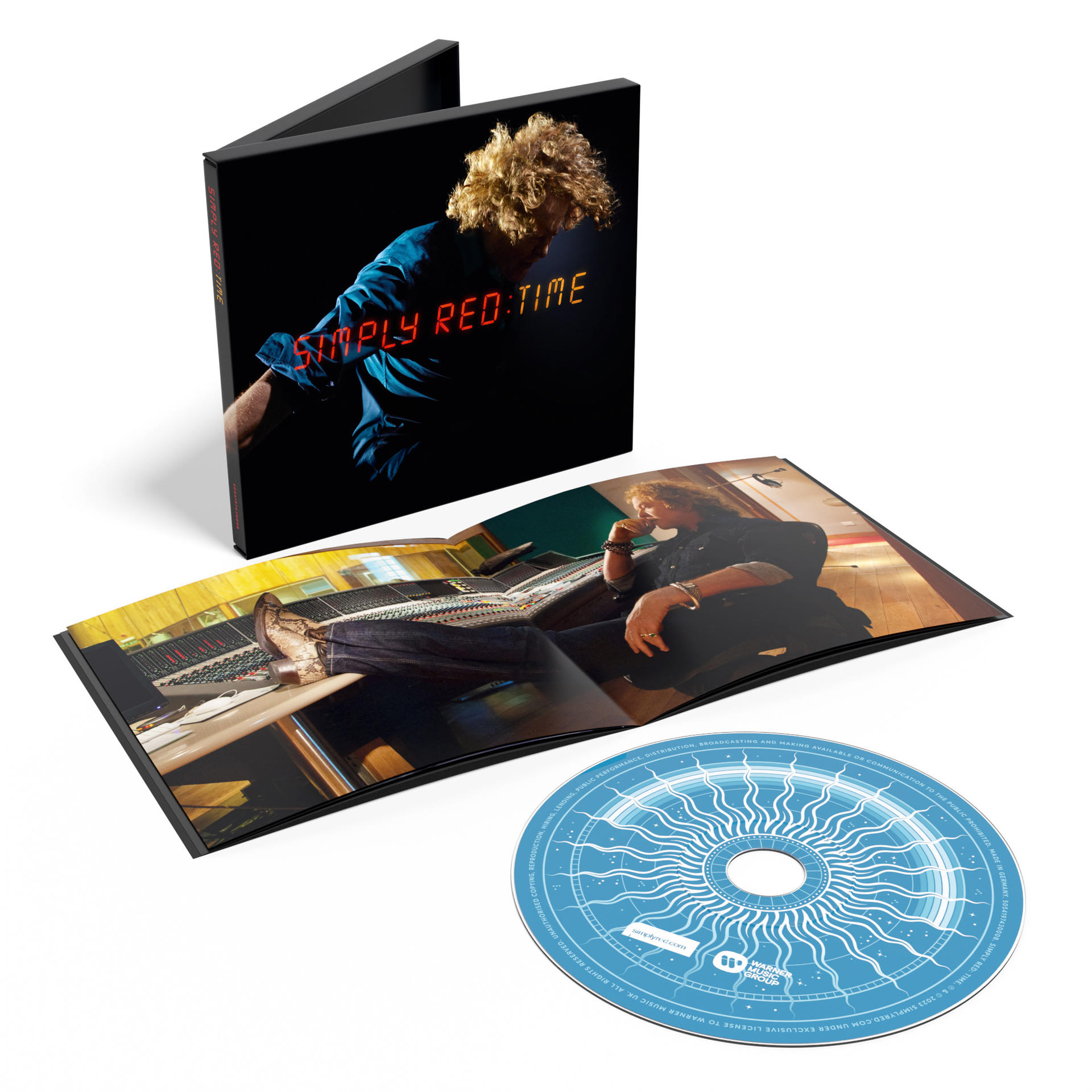 Simply Red 'Time' CD album borítója, nyitva, és CD lemez, fekete háttérrel.