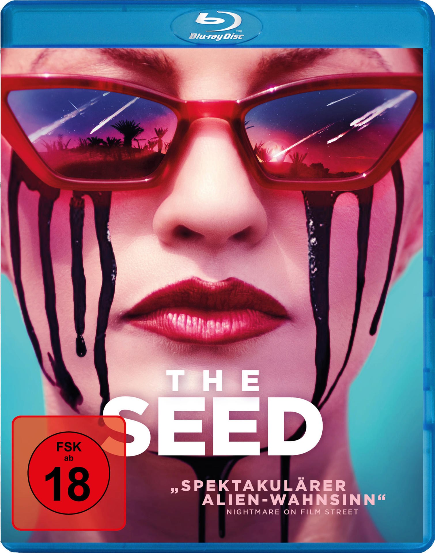 Blu-ray-Disc-Cover. Eine Frau mit roter Sonnenbrille und schwarzen Tropfen unter den Augen. Der Titel lautet 'THE SEED'.