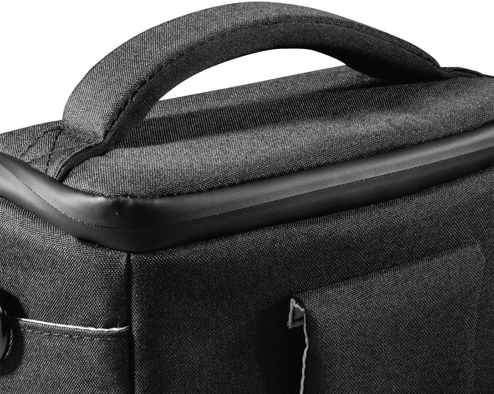 Close-up of a black camera bag handle, with a stitched seam detail.