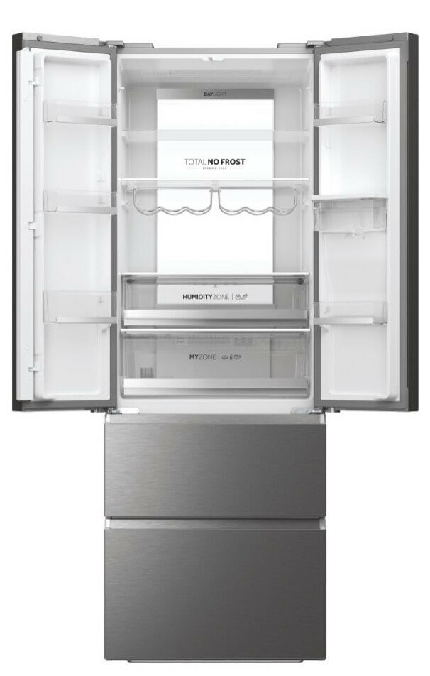 Otwarta lodówka z wieloma półkami i szufladami. Stal nierdzewna z białym wnętrzem.