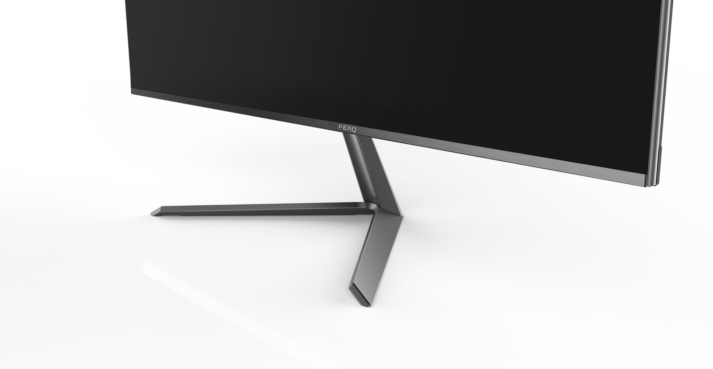 Monitor mit Ständer, Nahaufnahme, auf reflektierender Oberfläche. Der Monitor ist schwarz.
