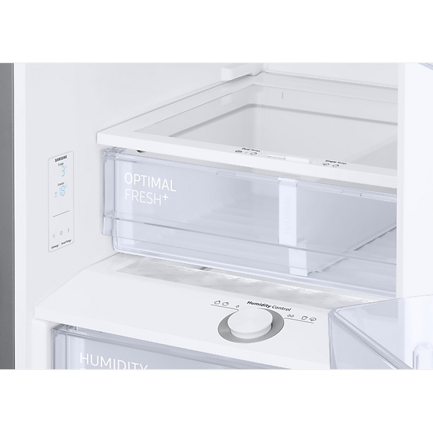 À l'intérieur d'un réfrigérateur, montrant un tiroir de rangement transparent et des commandes.