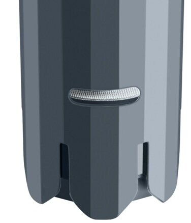 Zbliżenie szarego, cylindrycznego obiektu z zakrzywionym wgłębieniem.