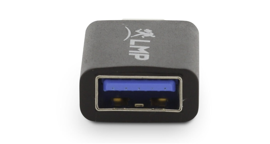 Un adaptateur USB noir avec un port USB bleu.