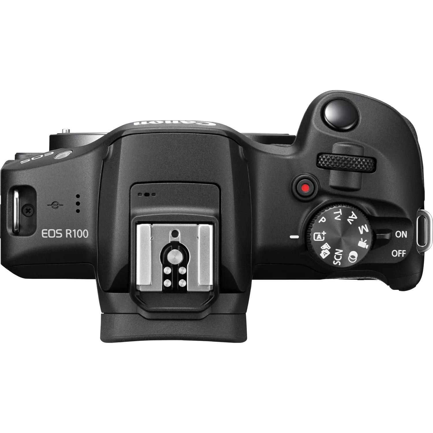 Draufsicht auf eine schwarze Canon EOS R100 Kamera, zeigt Bedienelemente und Tasten.