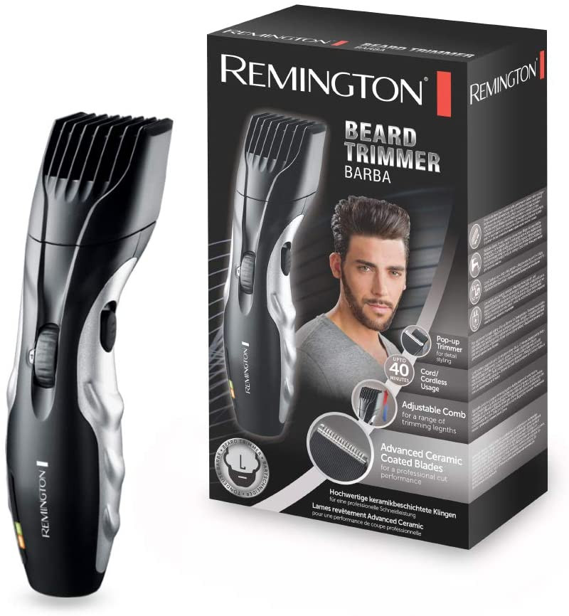 Egy Remington szakállvágó és a doboza fehér háttér előtt.