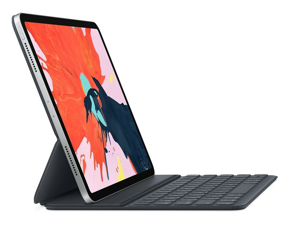 Srebrny tablet z klawiaturą i kolorową sztuką abstrakcyjną na ekranie.