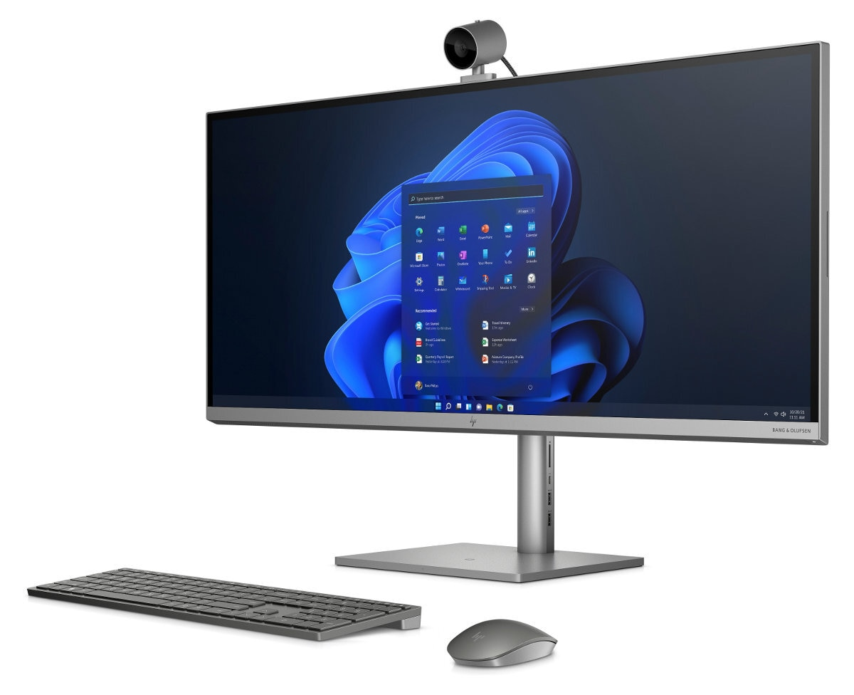 Kompletny komputer stacjonarny z dużym monitorem, klawiaturą, myszą i kamerą internetową.