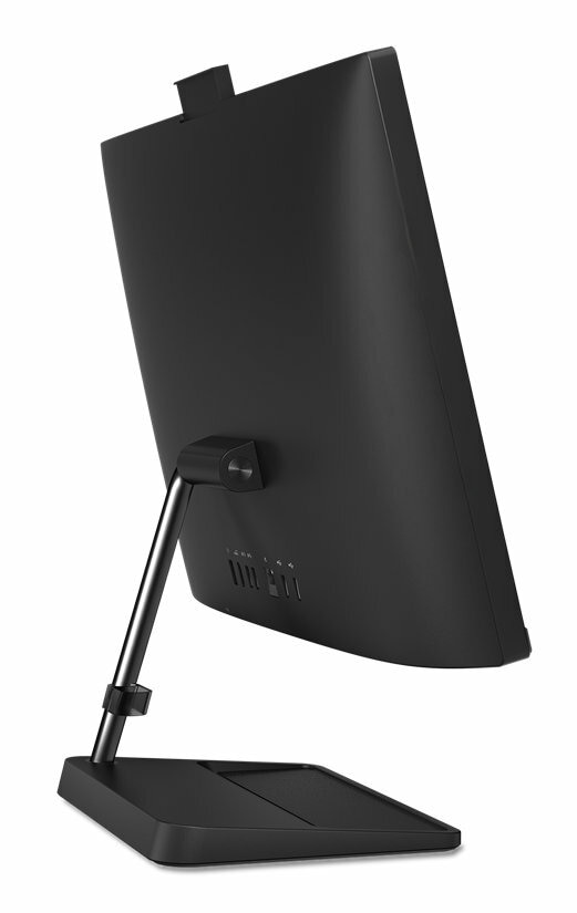 Czarny komputer All-in-One od tyłu, pokazujący porty i podstawę. Ekran jest czarny.