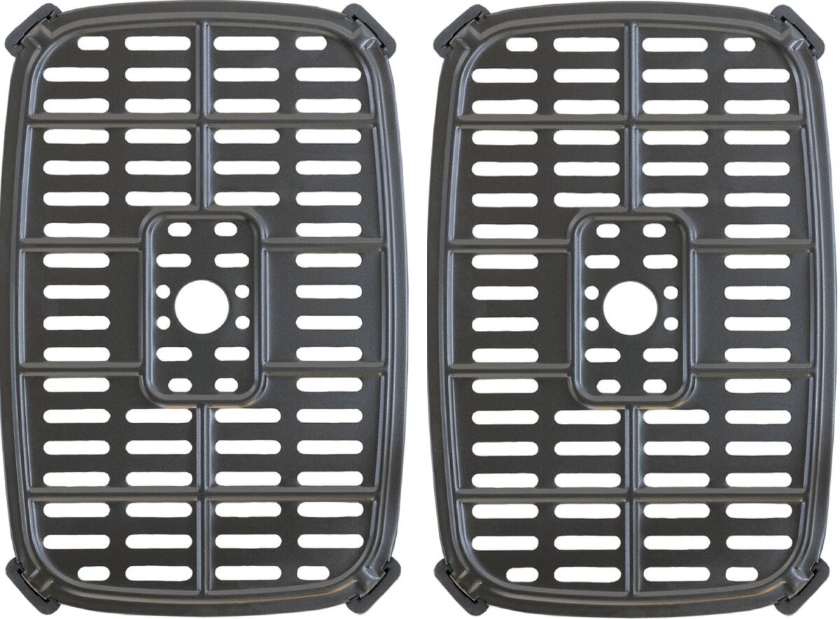 Dwa czarne ruszty z wzorem kratki. Każdy ma centralny otwór i zaokrąglone rogi.